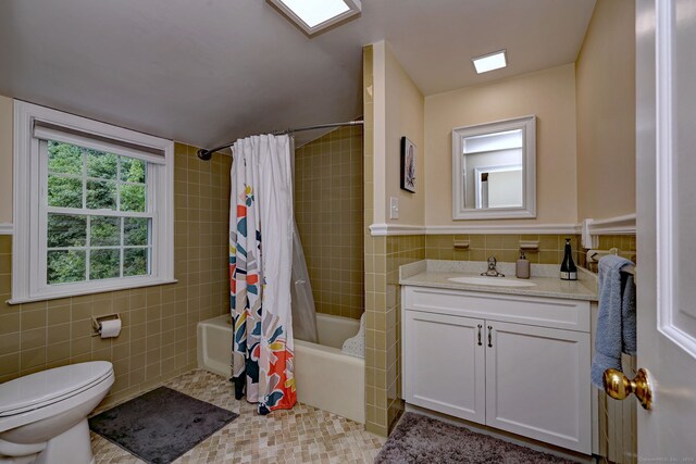 691 Buttonball Rd, Orange, CT 06477 - full bathroom featuring tile walls, vanity, shower / tub combo with curtain, and toilet