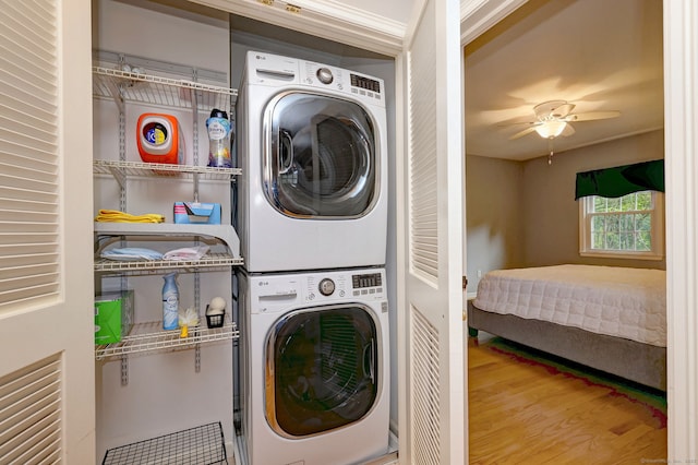 691 Buttonball Rd, Orange, CT 06477 - washroom featuring stacked washer / dryer, wood finished floors, and a ceiling fan
