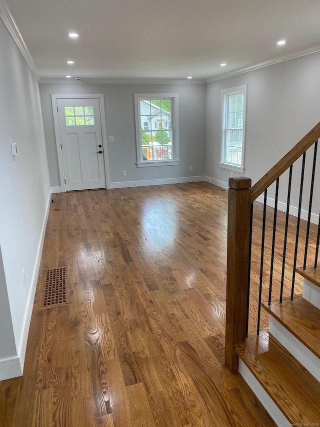 285 Alba Ave, Bridgeport, CT 06606 - entrance foyer featuring crown molding, plenty of natural light, wood finished floors, recessed lighting, and stairs
