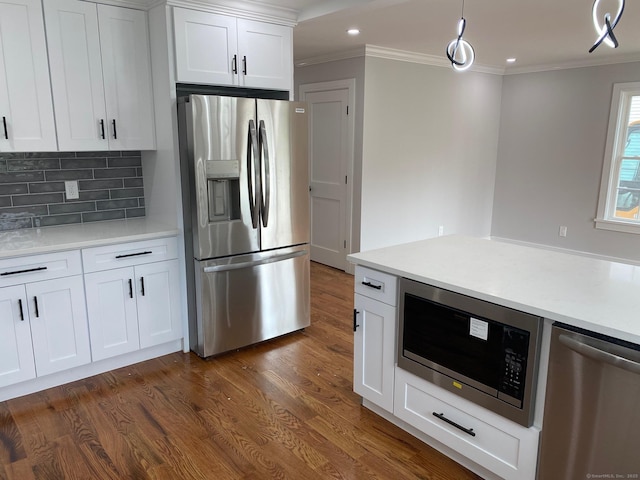 285 Alba Ave, Bridgeport, CT 06606 - kitchen featuring stainless steel appliances, crown molding, dark wood-style flooring, tasteful backsplash, and light countertops
