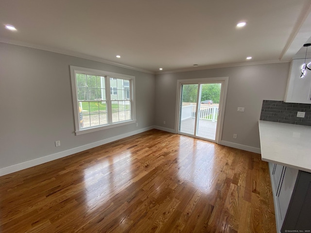 285 Alba Ave, Bridgeport, CT 06606 - unfurnished living room featuring ornamental molding, wood finished floors, and recessed lighting