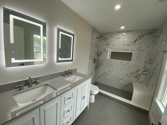 285 Alba Ave, Bridgeport, CT 06606 - bathroom featuring a marble finish shower, double vanity, recessed lighting, and tile patterned flooring