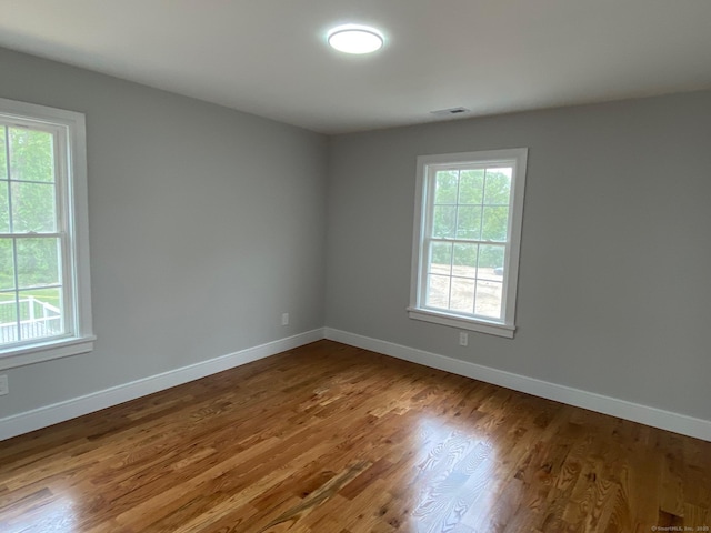285 Alba Ave, Bridgeport, CT 06606 - spare room with plenty of natural light and wood finished floors