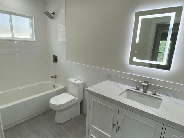 285 Alba Ave, Bridgeport, CT 06606 - full bathroom featuring vanity, healthy amount of natural light, shower / washtub combination, and tile walls