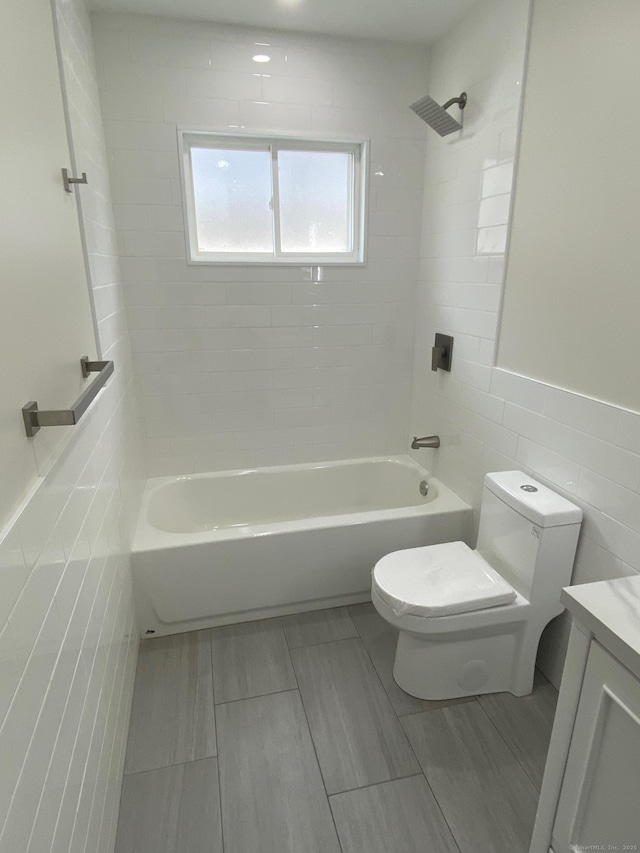 285 Alba Ave, Bridgeport, CT 06606 - full bathroom with tile walls, vanity, and bathtub / shower combination