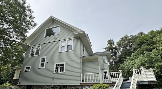 1666 Ridge Rd, North Haven, CT 06473 - back of property with a deck and stairs