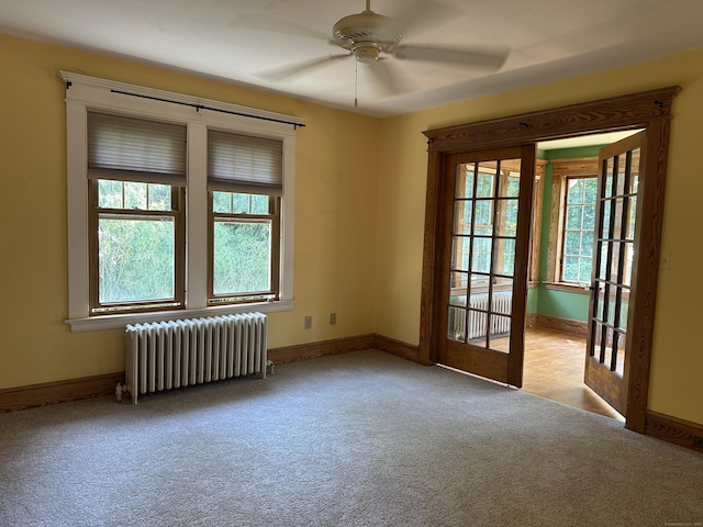 1666 Ridge Rd, North Haven, CT 06473 - empty room with radiator heating unit, carpet, and ceiling fan