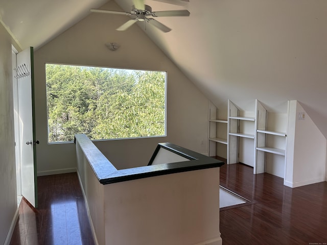 1666 Ridge Rd, North Haven, CT 06473 - hallway with lofted ceiling, built in shelves, an upstairs landing, and dark wood-style floors