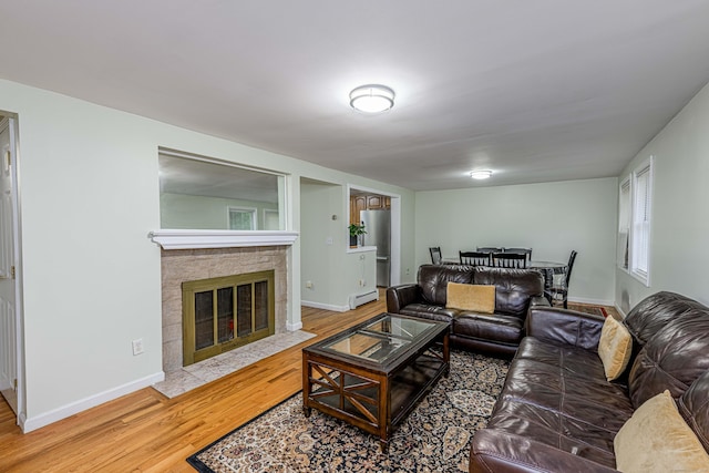 92 Blakeslee Ave, North Haven, CT 06473 - living room featuring wood finished floors, a fireplace, baseboards, and baseboard heating