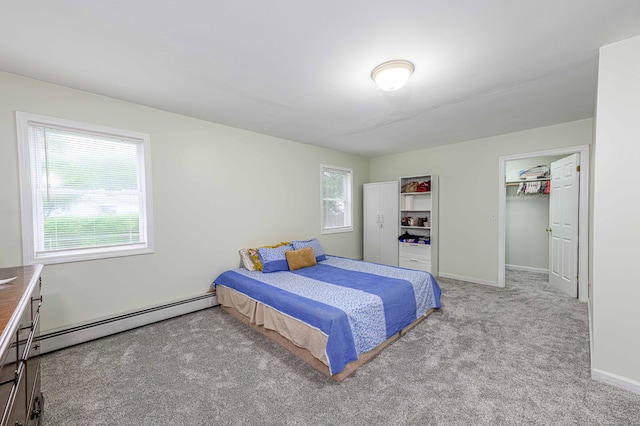 92 Blakeslee Ave, North Haven, CT 06473 - bedroom with a baseboard radiator, carpet floors, baseboards, and a walk in closet