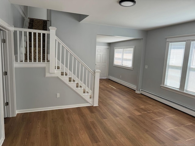 187 Jewett Ave, Bridgeport, CT 06606 - entrance foyer with a baseboard heating unit, stairway, wood finished floors, and a baseboard radiator