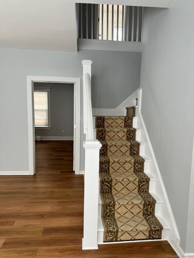 187 Jewett Ave, Bridgeport, CT 06606 - stairs featuring wood finished floors and baseboards