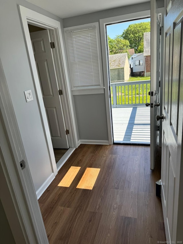 187 Jewett Ave, Bridgeport, CT 06606 - doorway with dark wood finished floors and baseboards