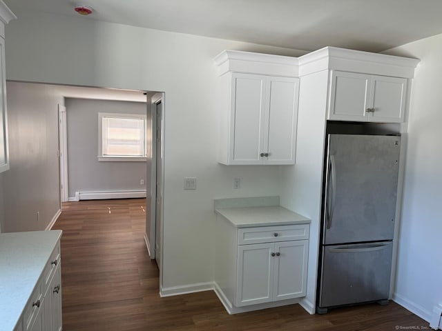187 Jewett Ave, Bridgeport, CT 06606 - kitchen with freestanding refrigerator, a baseboard radiator, light countertops, and dark wood finished floors