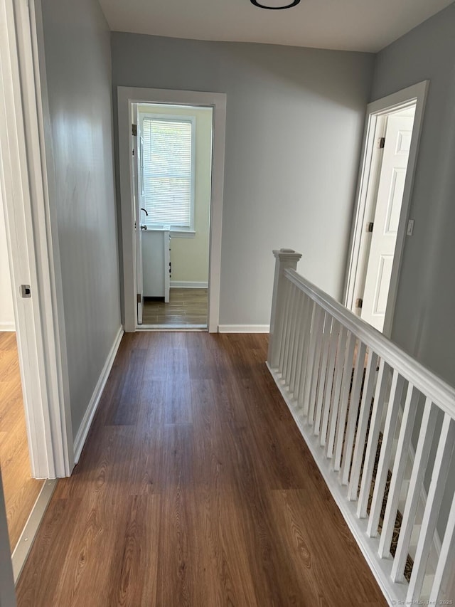 187 Jewett Ave, Bridgeport, CT 06606 - hallway featuring an upstairs landing, dark wood-style flooring, and baseboards