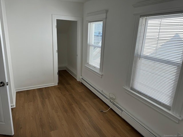 187 Jewett Ave, Bridgeport, CT 06606 - empty room with a baseboard radiator, wood finished floors, and baseboards