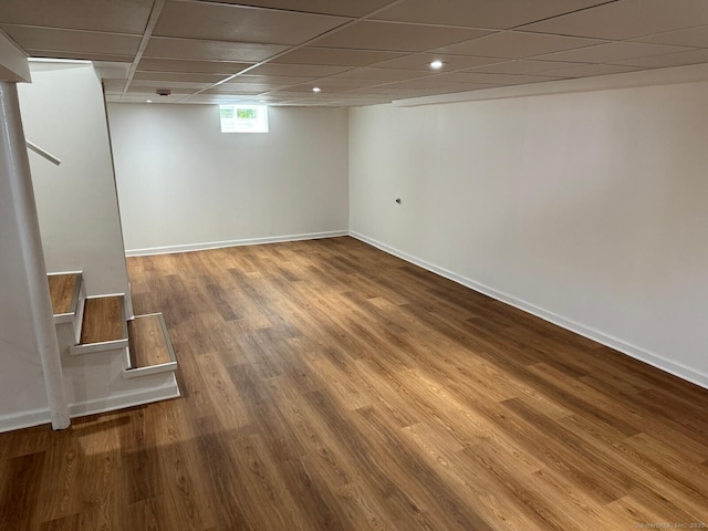 187 Jewett Ave, Bridgeport, CT 06606 - basement with stairway, wood finished floors, baseboards, a paneled ceiling, and recessed lighting