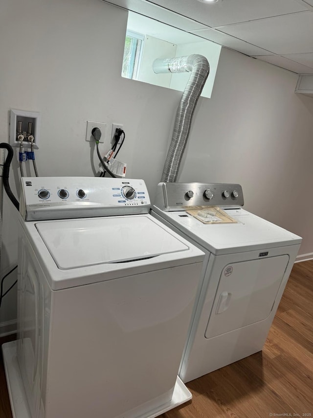 187 Jewett Ave, Bridgeport, CT 06606 - laundry area with washer and clothes dryer and wood finished floors
