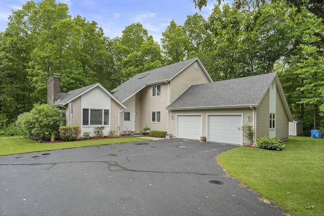 21 Corrina Ln, Salem, CT 06420 - view of front facade featuring an attached garage, driveway, a front yard, roof with shingles, and a chimney