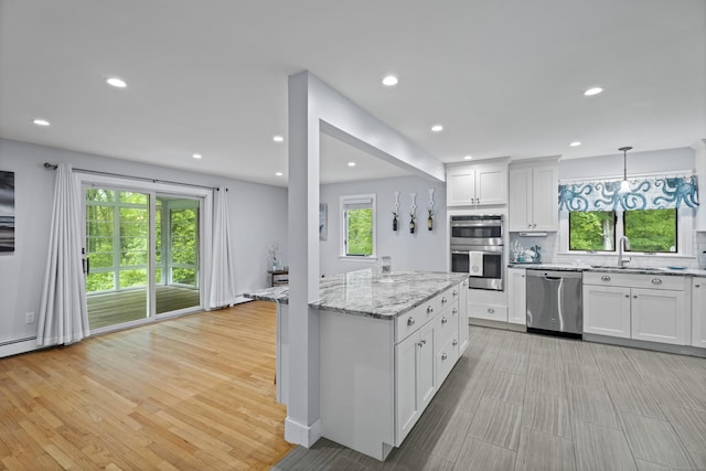 21 Corrina Ln, Salem, CT 06420 - kitchen featuring appliances with stainless steel finishes, a sink, light stone countertops, white cabinets, and recessed lighting