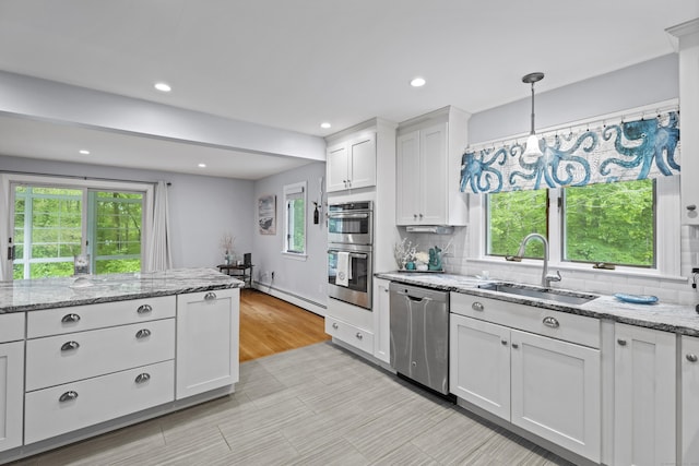 21 Corrina Ln, Salem, CT 06420 - kitchen with appliances with stainless steel finishes, a sink, plenty of natural light, a baseboard heating unit, and recessed lighting