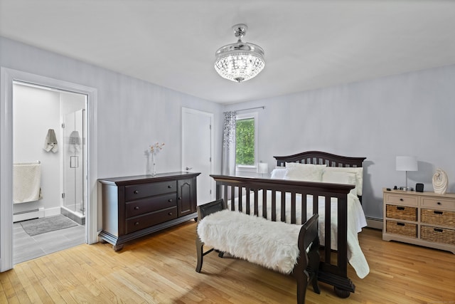 21 Corrina Ln, Salem, CT 06420 - bedroom with a baseboard heating unit, light wood-style floors, a chandelier, and connected bathroom