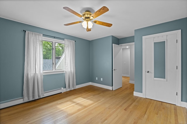 21 Corrina Ln, Salem, CT 06420 - unfurnished bedroom featuring wood finished floors, baseboard heating, baseboards, and a ceiling fan