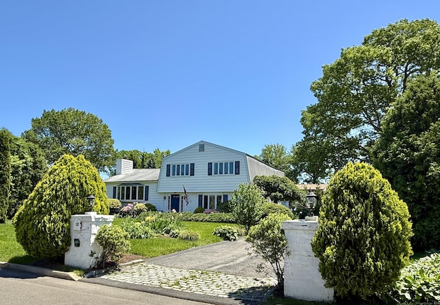 12 Rolling Ln, Norwalk, CT 06851 - split level home featuring driveway and a chimney