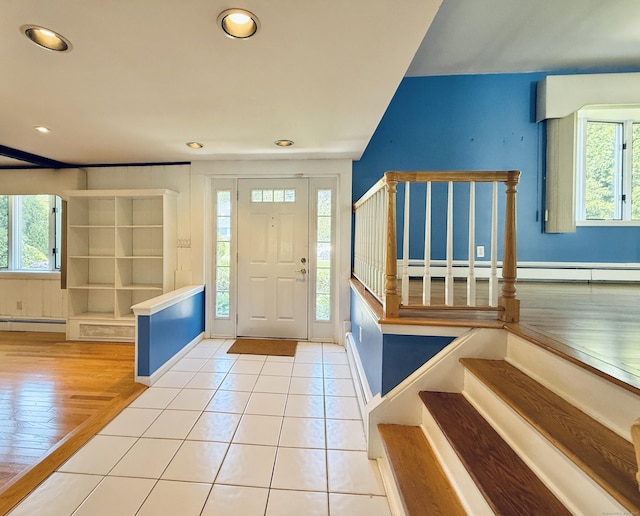 12 Rolling Ln, Norwalk, CT 06851 - tiled entryway with plenty of natural light, stairs, recessed lighting, a baseboard heating unit, and a baseboard radiator