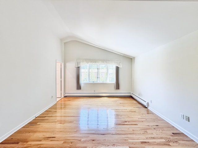 12 Rolling Ln, Norwalk, CT 06851 - empty room featuring vaulted ceiling, wood finished floors, a baseboard radiator, and baseboards