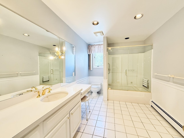 12 Rolling Ln, Norwalk, CT 06851 - full bath with a baseboard heating unit, wainscoting, toilet, tile patterned floors, and vanity