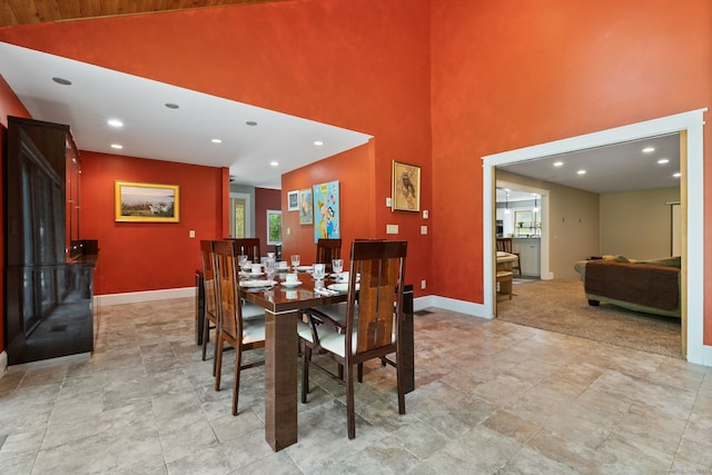 254 Haley Rd, Groton, CT 06355 - dining space with a high ceiling, recessed lighting, and stone finish floors