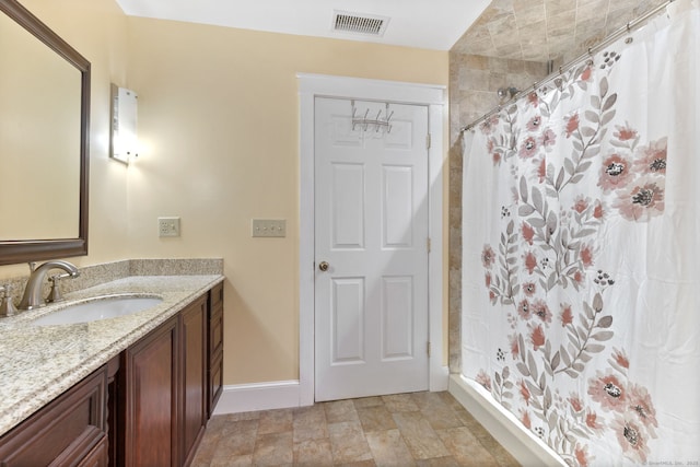 254 Haley Rd, Groton, CT 06355 - bathroom featuring vanity, a shower with curtain, and stone finish flooring