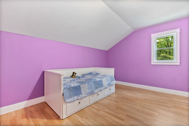 254 Haley Rd, Groton, CT 06355 - bedroom featuring lofted ceiling and light wood-style floors