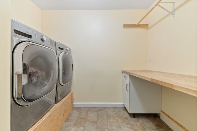 254 Haley Rd, Groton, CT 06355 - laundry room with washer and clothes dryer and stone finish flooring