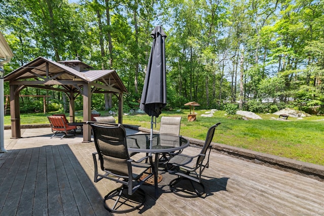 254 Haley Rd, Groton, CT 06355 - wooden terrace featuring a gazebo, a yard, outdoor dining area, and view of wooded area