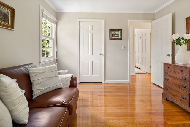 129 Brookmere Dr, Fairfield, CT 06824 - living area with light wood-type flooring, crown molding, and baseboards