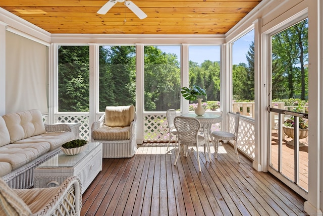 129 Brookmere Dr, Fairfield, CT 06824 - sunroom / solarium with ceiling fan, view of wooded area, and outdoor lounge area