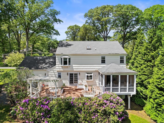 129 Brookmere Dr, Fairfield, CT 06824 - rear view of property with a sunroom and roof with shingles