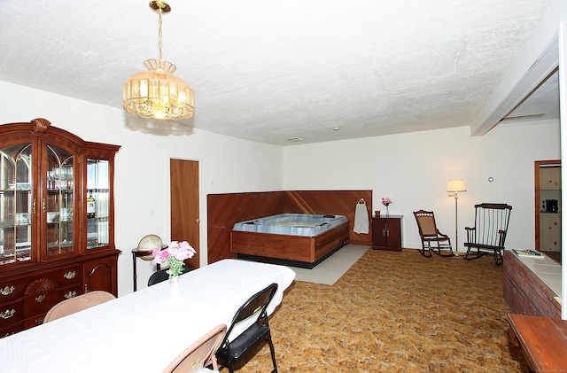 171 Main St, East Lyme, CT 06357 - bedroom featuring a chandelier, a textured ceiling, and carpet