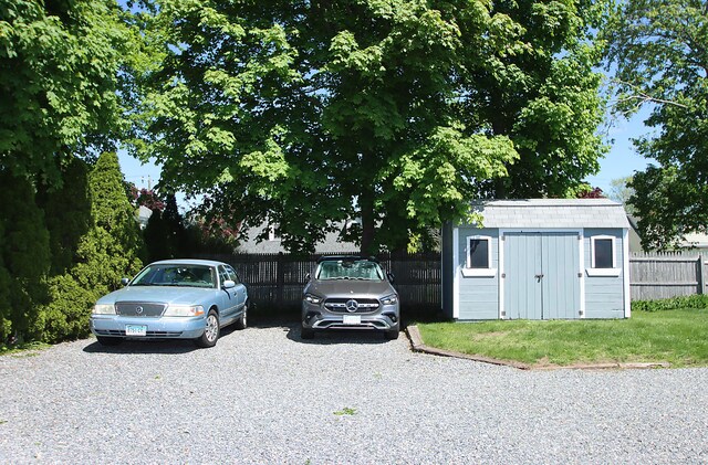 171 Main St, East Lyme, CT 06357 - view of parking / parking lot featuring a storage shed