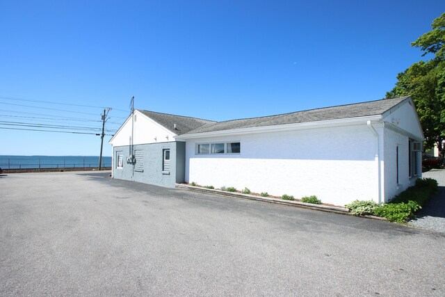 171 Main St, East Lyme, CT 06357 - view of side of property with stucco siding