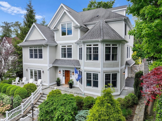 13 Witch Ln, Norwalk, CT 06853 - view of front facade with roof with shingles and stairway