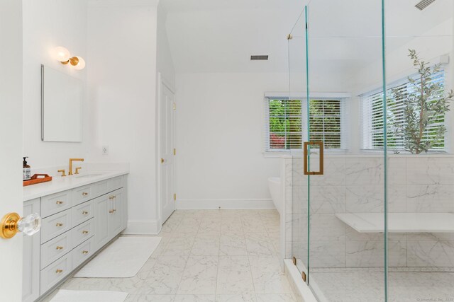 13 Witch Ln, Norwalk, CT 06853 - bathroom featuring vanity, a freestanding tub, a stall shower, marble look tiles, and baseboards