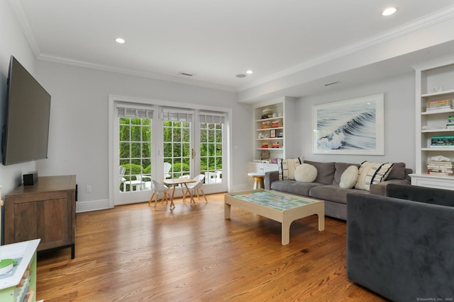 13 Witch Ln, Norwalk, CT 06853 - living room featuring ornamental molding, built in shelves, light wood-style floors, recessed lighting, and baseboards