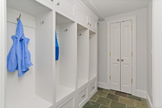 13 Witch Ln, Norwalk, CT 06853 - mudroom with baseboards and dark stone finish flooring