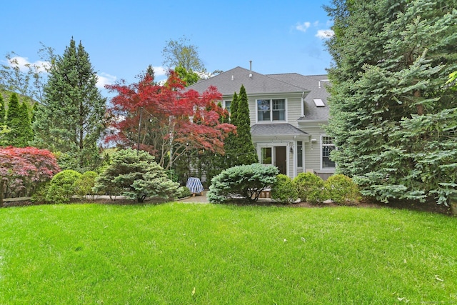 13 Witch Ln, Norwalk, CT 06853 - view of front of house with a front lawn and a shingled roof