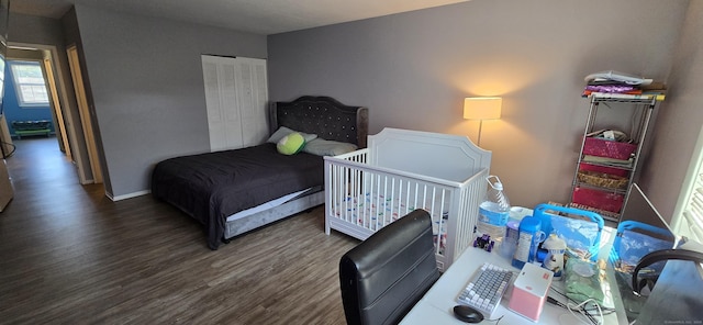 50 Greenhouse Rd Unit 41C, Bridgeport, CT 06606 - bedroom featuring wood finished floors, a closet, and baseboards