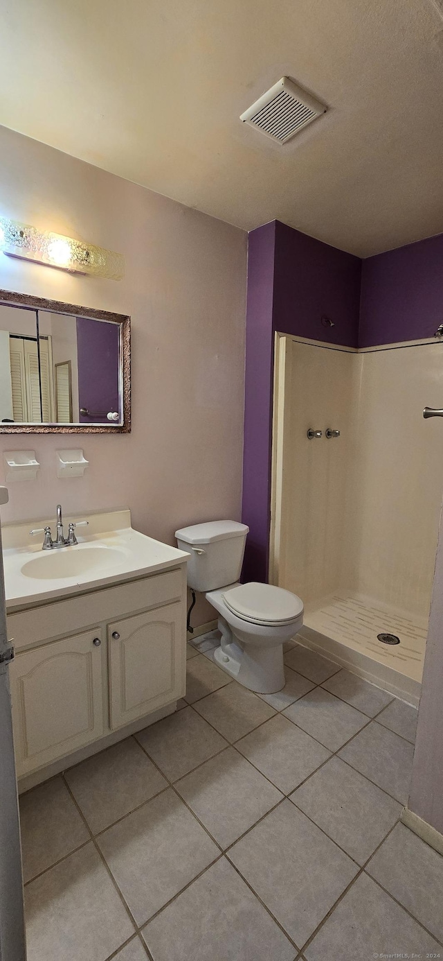 50 Greenhouse Rd Unit 41C, Bridgeport, CT 06606 - full bath with tile patterned flooring, a stall shower, vanity, and toilet
