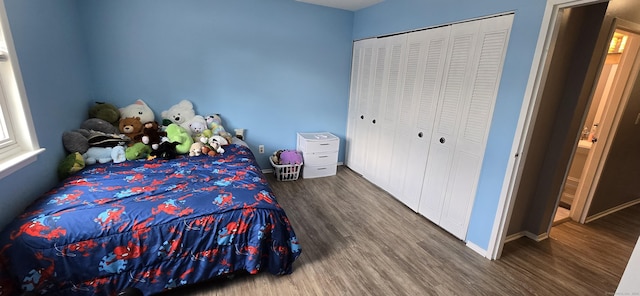 50 Greenhouse Rd Unit 41C, Bridgeport, CT 06606 - bedroom with wood finished floors, baseboards, a closet, and multiple windows